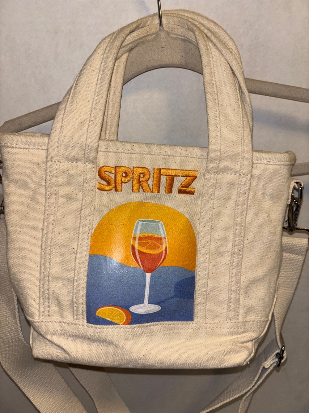 C&C CALIFORNIA BRAND OFF WHITE CANVAS WITH EMBROIDERED SPRITZ AND GLASS DESIGN